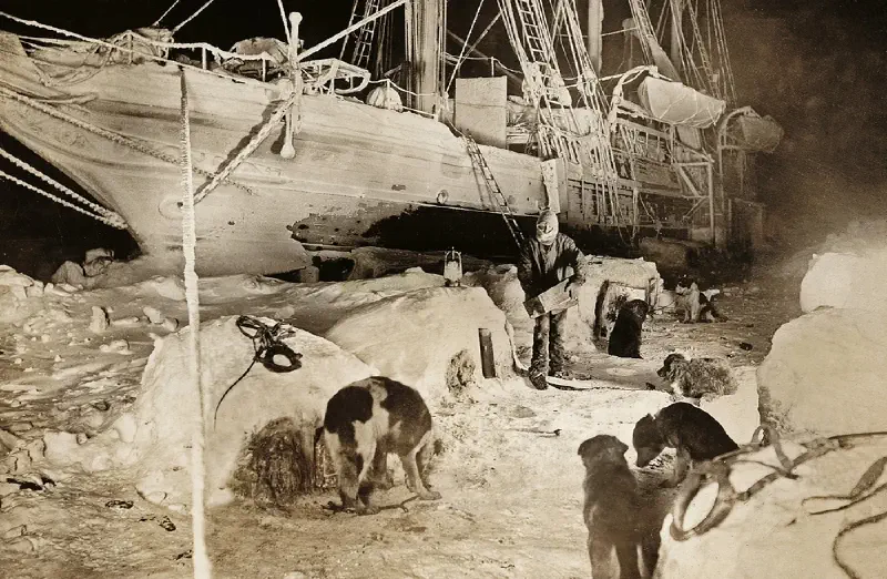 Expedition members salvaging supplies from the trapped Endurance in April 1916, working across ice floes in harsh Antarctic conditions. The scene conveys urgency and determination as crew members manage critical resources in a desperate survival situation.